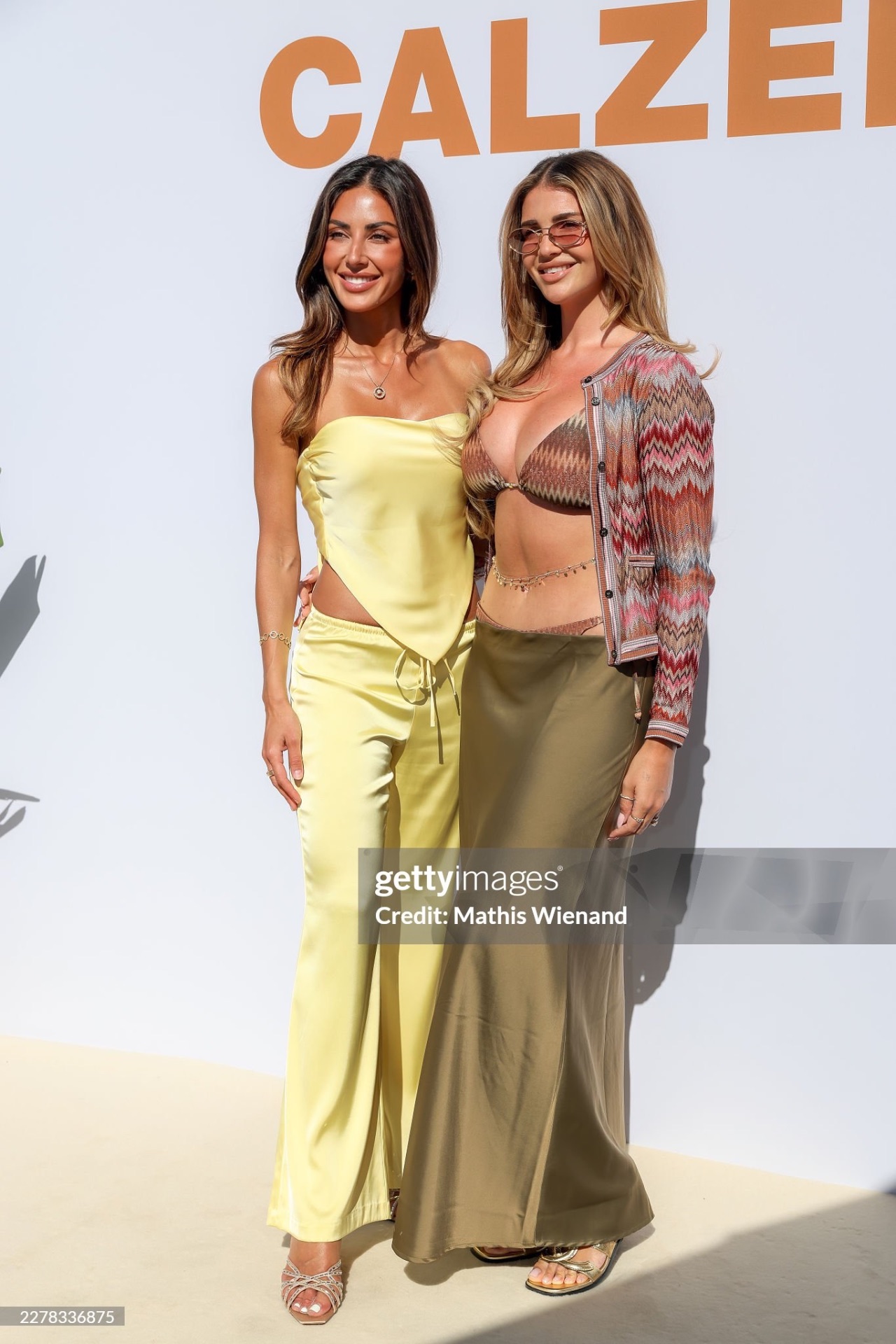 Jana Azizi in yellow satin at Calzedonia